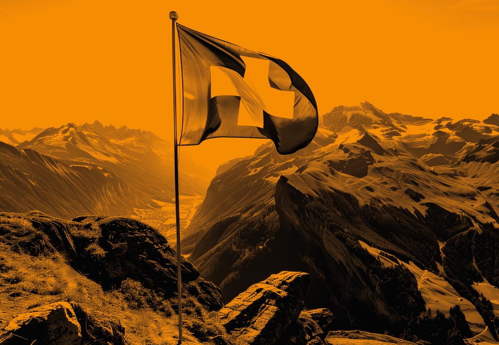 Eine Schweizer Landesflagge auf dem Gebirge weht im Wind.